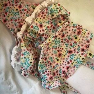 Features vibrant colors ruffle one piece